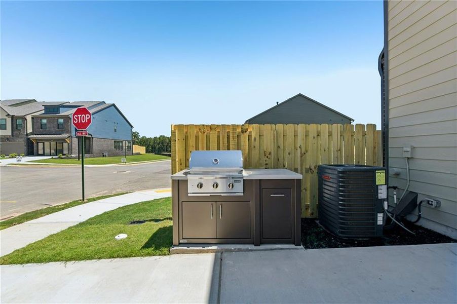 Exterior details and patio area of a home in Tribute, Hoschton (Image 3).