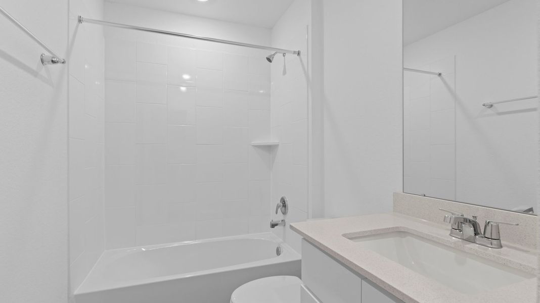 Furnished interior view inside a new home in Caldwell Crossing, Iowa Colony (Image 6).