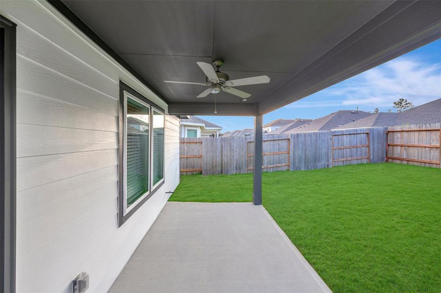 Exterior details and patio area of a home in Pinewood at Grand Texas, New Caney (Image 3).