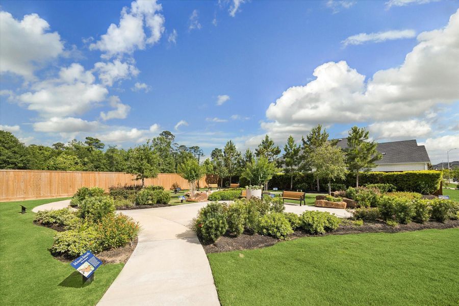 Beautifully landscaped community gathering space featuring winding walking paths, lush green spaces, mature trees, and peaceful seating areas designed for relaxation and connection with neighbors. Beautifully landscaped community gathering space featuring winding walking paths, lush green spaces, mature trees, and peaceful seating areas designed for relaxation and connection with neighbors.