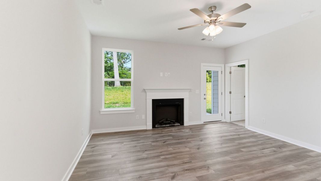 Gathering room with ceiling fan and fireplace Gathering room with ceiling fan and fireplace