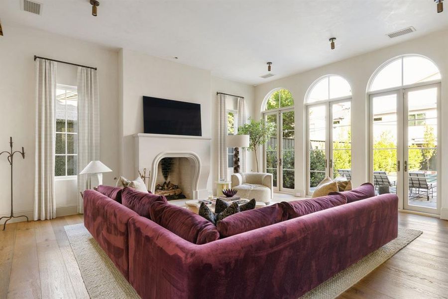 Living area featuring a fireplace and light wood-type flooring