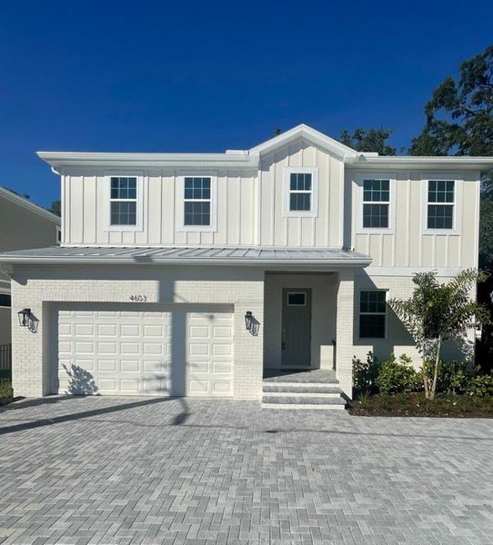 Front exterior of a new home in , Tampa, FL, highlighting curb appeal (Image 1). Front exterior of a new home in , Tampa, FL, highlighting curb appeal (Image 1).