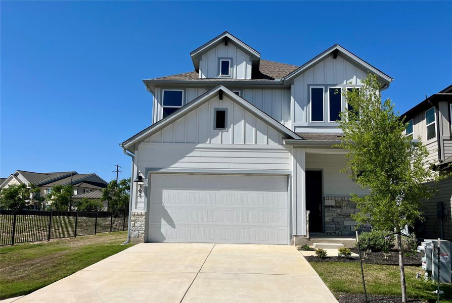 Front exterior of a new home in Fleetwood, Dripping Springs, TX, highlighting curb appeal (Image 1). Front exterior of a new home in Fleetwood, Dripping Springs, TX, highlighting curb appeal (Image 1).
