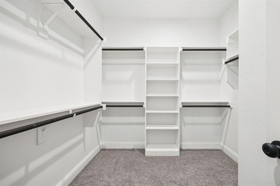 (Bedroom #1) Master bedroom Walk in closet with light carpet (Bedroom #1) Master bedroom Walk in closet with light carpet