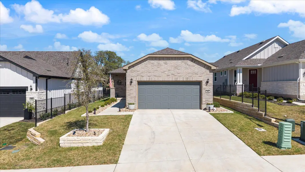 View of front facade with concrete driveway, a garage, and brick siding View of front facade with concrete driveway, a garage, and brick siding