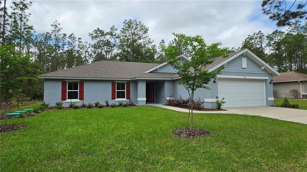 Front exterior of a new home in , Citrus Springs, FL, highlighting curb appeal (Image 2). Front exterior of a new home in , Citrus Springs, FL, highlighting curb appeal (Image 2).