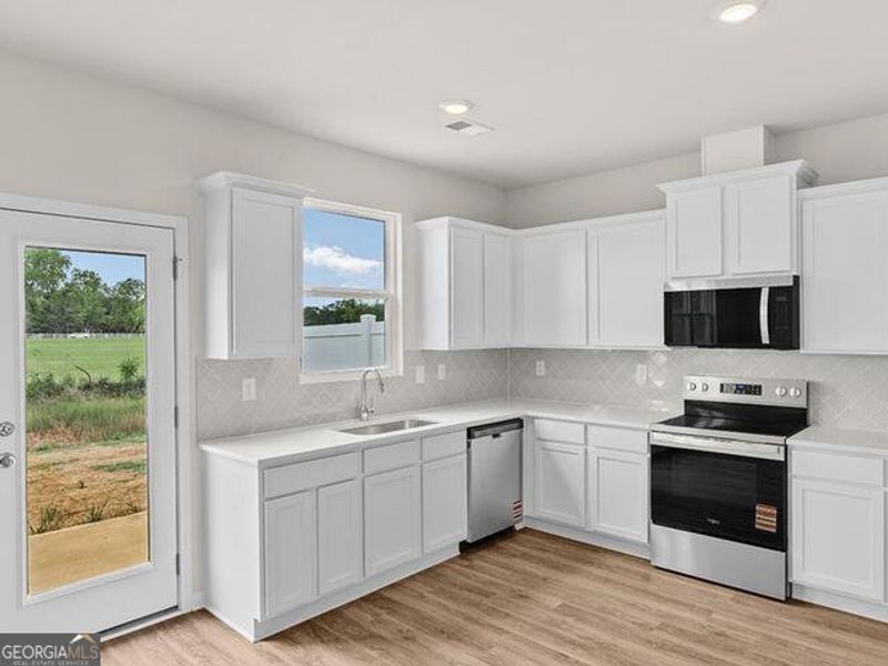 Furnished interior view inside a new home in Remington Chase, Perry (Image 8).