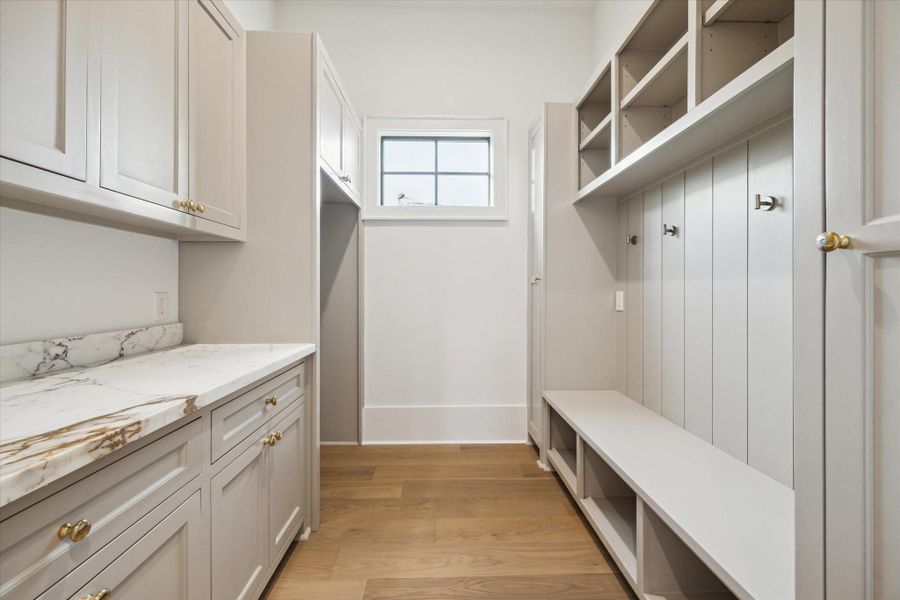 Mud room with copious amounts of storage*Picture is of a recently constructed home by the builder.  1519 Candlelight will be similar in quality, but these pictures are not meant to be an exact representation of the new home. Specs of home may change at sole discretion of the seller.