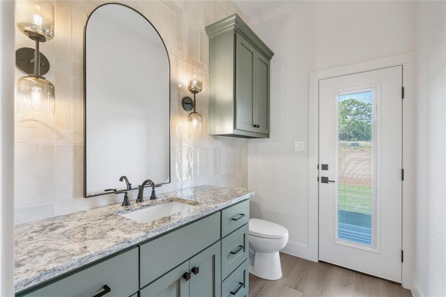 Love, love, love this powder bathroom with access to the back yard.  Great for a future pool bath!!