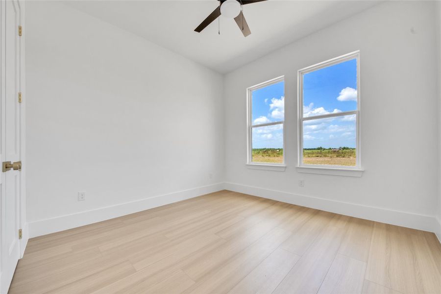 Spacious secondary bedrooms feature large windows that provide abundant natural light and closets with custom built-ins. Spacious secondary bedrooms feature large windows that provide abundant natural light and closets with custom built-ins.
