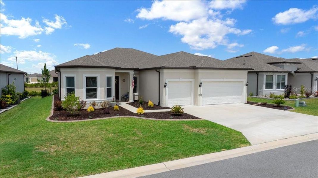 Front exterior of a new home in Del Webb Stone Creek, Ocala, FL, highlighting curb appeal (Image 2).