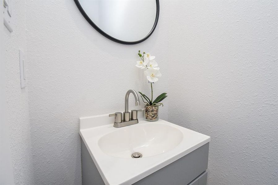 Even the half-bath offers sleek, contemporary style.