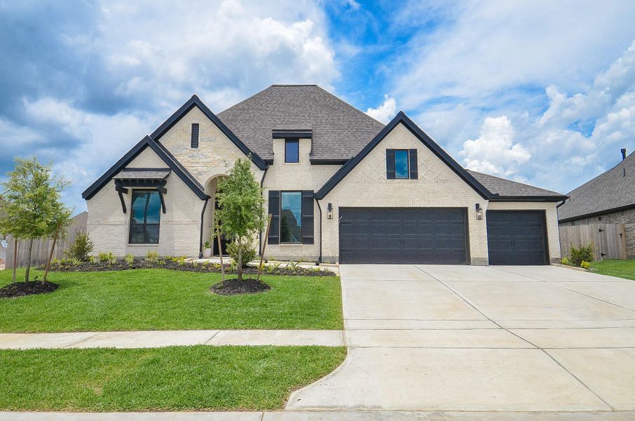 Front exterior of a new home in Escondido, Magnolia, TX, highlighting curb appeal (Image 24).