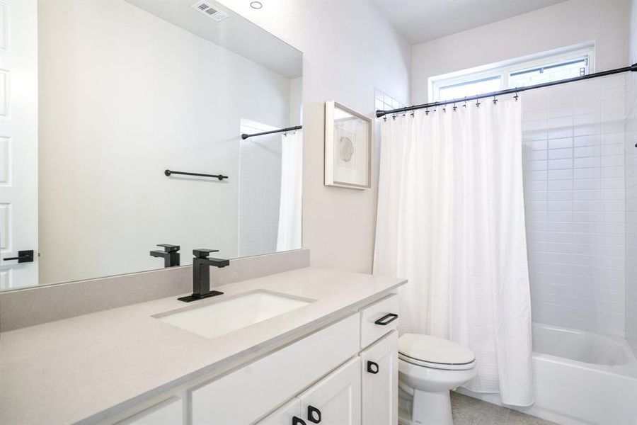Stylish & Streamlined - Another full bath with modern hardware, sleek fixtures, and plenty of counter space—designed to accommodate comfort and ease. Stylish & Streamlined - Another full bath with modern hardware, sleek fixtures, and plenty of counter space—designed to accommodate comfort and ease.