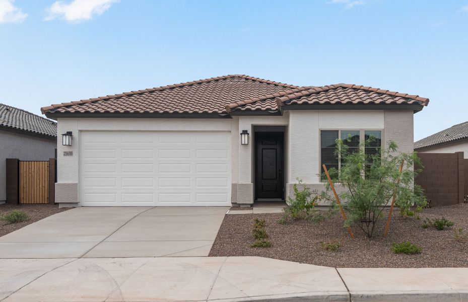 Front exterior of a new home in Hayden Estates, Buckeye, AZ, highlighting curb appeal (Image 1). Front exterior of a new home in Hayden Estates, Buckeye, AZ, highlighting curb appeal (Image 1).