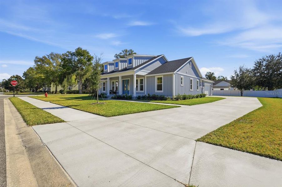 Front exterior of a new home in , Lake Helen, FL, highlighting curb appeal (Image 33).