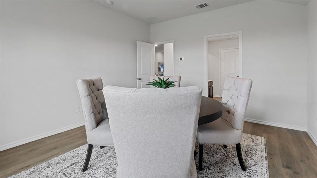 Dining space featuring wood finished floors and baseboards Dining space featuring wood finished floors and baseboards