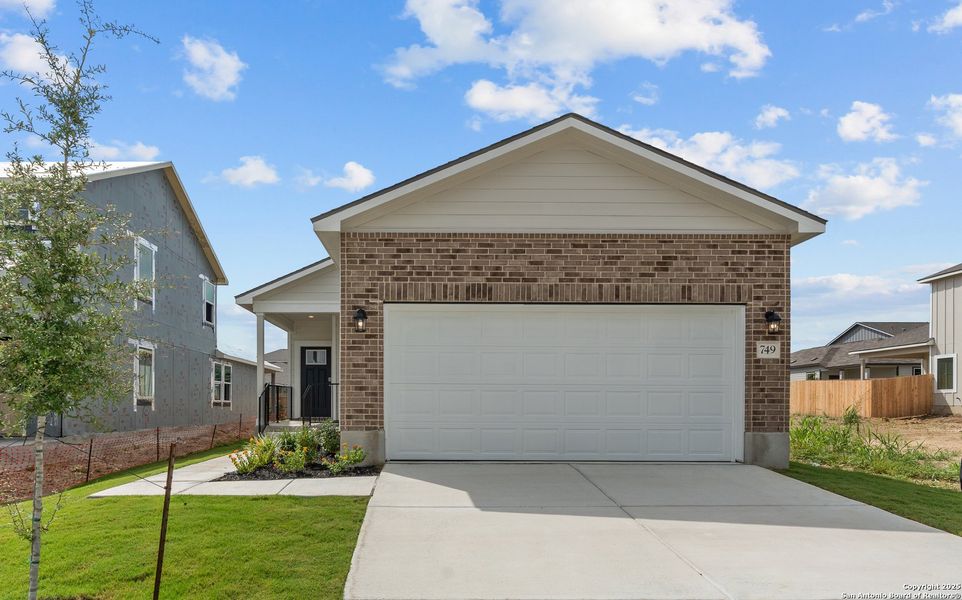 Front exterior of a new home in Highland Ridge, New Braunfels, TX, highlighting curb appeal (Image 15). Front exterior of a new home in Highland Ridge, New Braunfels, TX, highlighting curb appeal (Image 15).