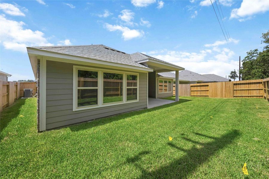 Exterior details and patio area of a home in Sundance Cove, Crosby (Image 20).
