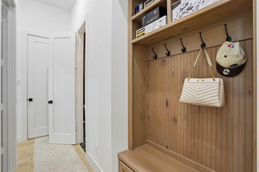 Mudroom with light wood-style flooring Mudroom with light wood-style flooring