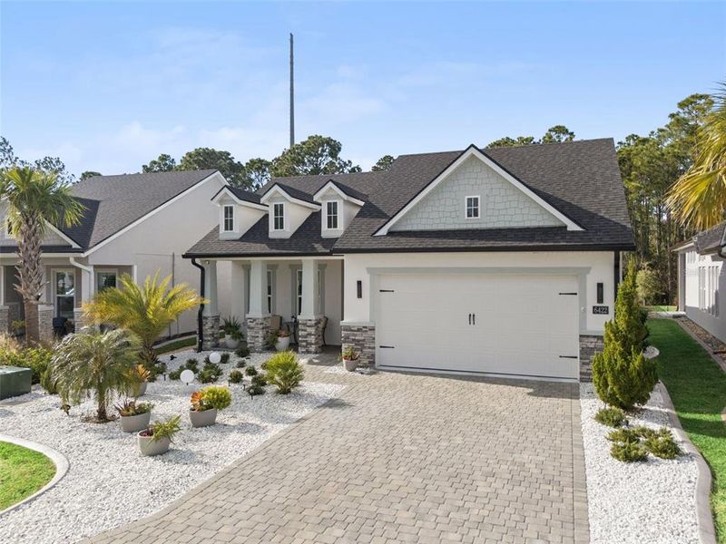 Front exterior of a new home in , Port Orange, FL, highlighting curb appeal (Image 24). Front exterior of a new home in , Port Orange, FL, highlighting curb appeal (Image 24).
