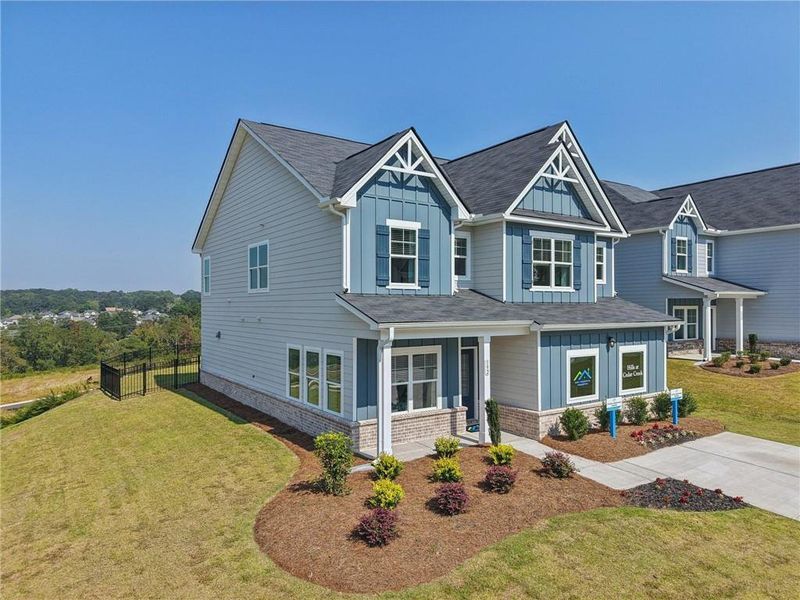 Front exterior of a new home in The Hills at Cedar Creek, Winder, GA, highlighting curb appeal (Image 26). Front exterior of a new home in The Hills at Cedar Creek, Winder, GA, highlighting curb appeal (Image 26).
