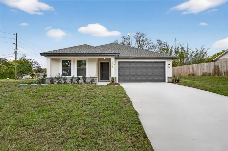 Front exterior of a new home in , Spring Hill, FL, highlighting curb appeal (Image 1). Front exterior of a new home in , Spring Hill, FL, highlighting curb appeal (Image 1).