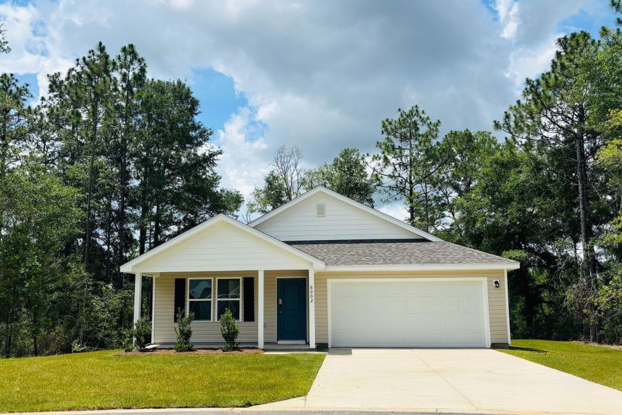 Front exterior of a new home in Meadow Creek, Crestview, FL, highlighting curb appeal (Image 1).
