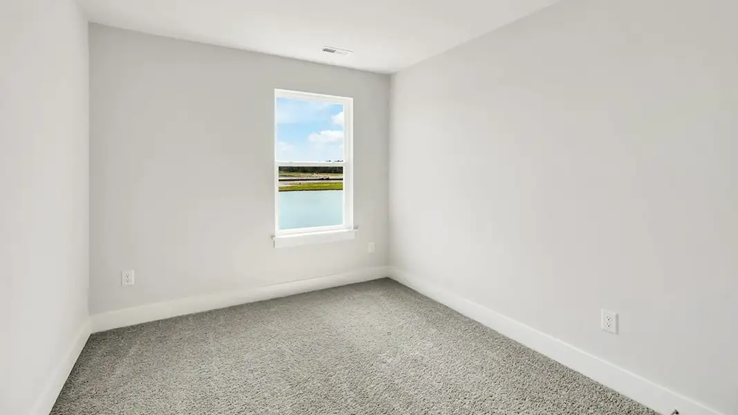 Spacious, unfurnished interior of a new home in The Cove at Indigo Preserve Townhomes, Leland (Image 15).