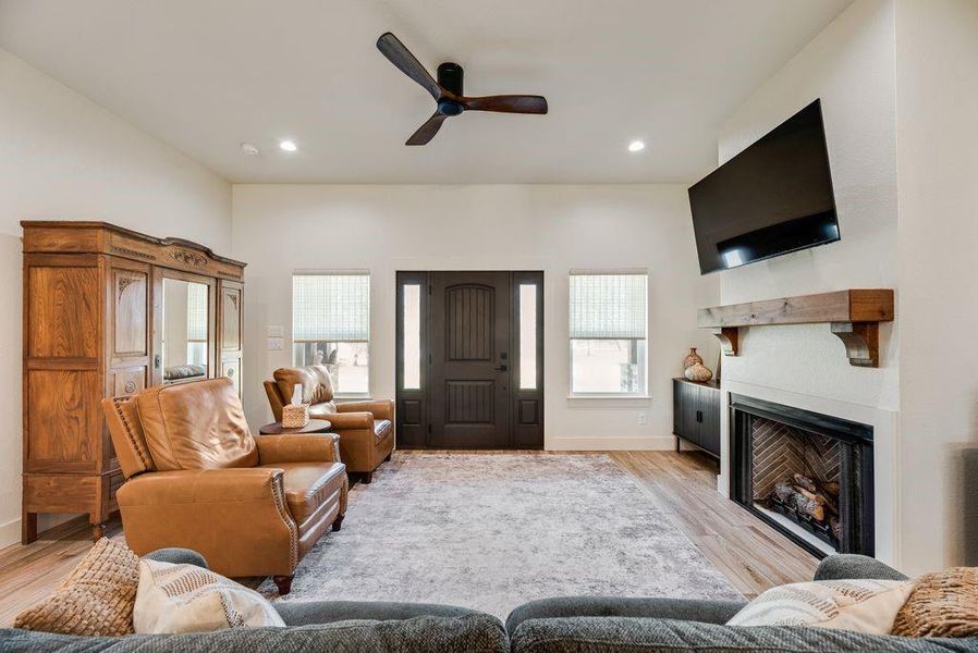 Amazing Living room with Stone fireplace, gas starter logs, and custom firebox that looks like a piece of artwork! 
Custom fabricated mantle and 10 foot ceilings