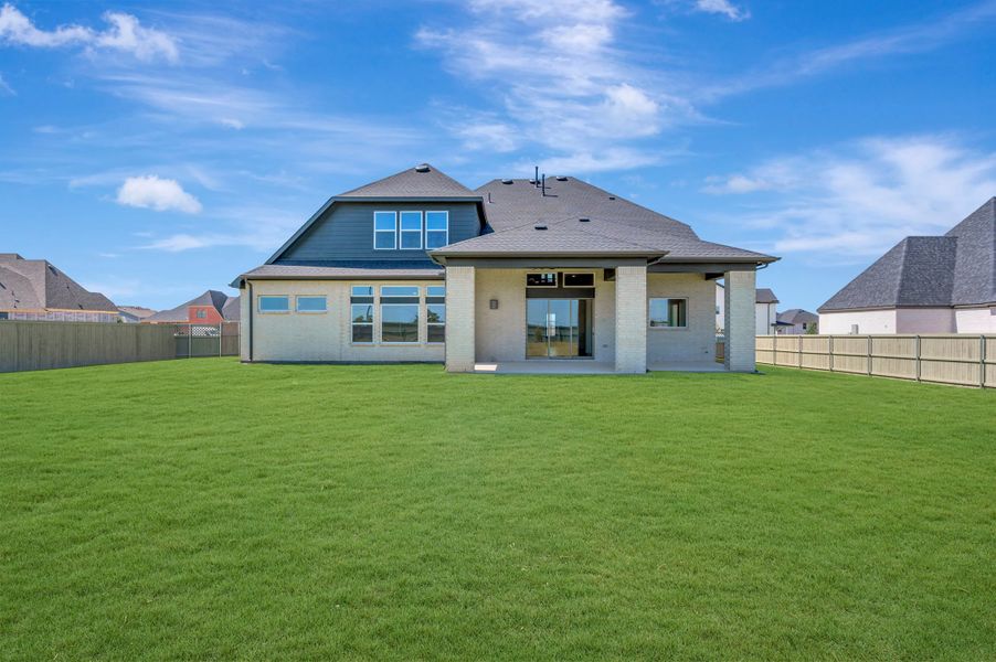 Exterior details and patio area of a home in Pecan Square - Estates, Northlake (Image 3).