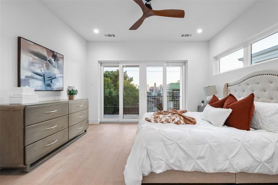 Bedroom featuring multiple windows, light wood-style floors, access to exterior, ceiling fan, and recessed lighting