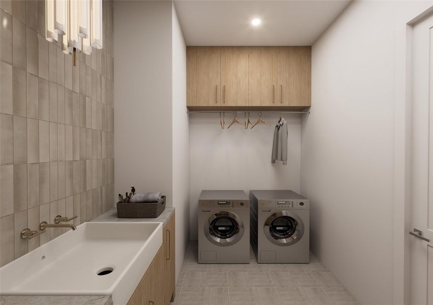 Designed with intention, this elevated laundry corridor pairs clean architectural lines with tactile finishes for a space that feels calm and collected. Custom cabinetry floats above a full hanging station, while sleek front-load appliances tuck seamlessly beneath tailored storage. Designed with intention, this elevated laundry corridor pairs clean architectural lines with tactile finishes for a space that feels calm and collected. Custom cabinetry floats above a full hanging station, while sleek front-load appliances tuck seamlessly beneath tailored storage.