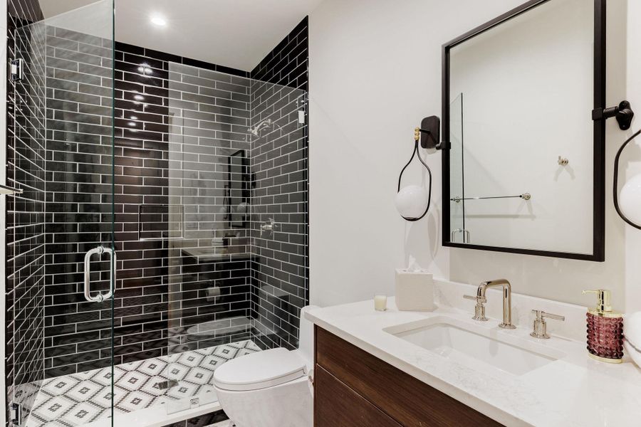 Stone, glass, and light combine to form a minimal yet elevated aesthetic consistent throughout the home. Stone, glass, and light combine to form a minimal yet elevated aesthetic consistent throughout the home.