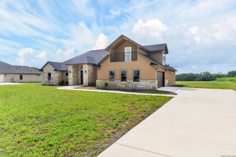 Front exterior of a new home in , Bandera, TX, highlighting curb appeal (Image 1). Front exterior of a new home in , Bandera, TX, highlighting curb appeal (Image 1).