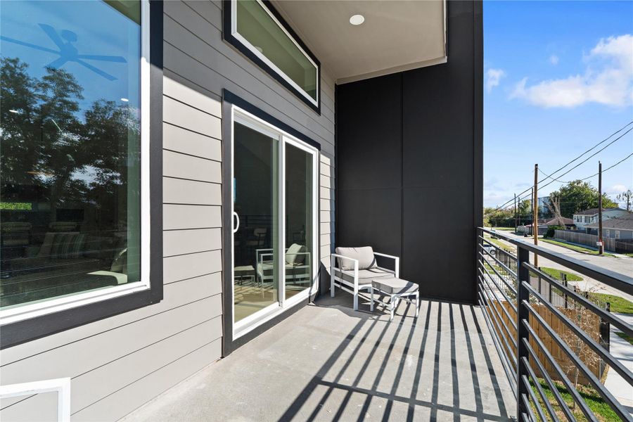 A generous covered balcony designed to accommodate outdoor seating & a grill for effortless open-air living. A generous covered balcony designed to accommodate outdoor seating & a grill for effortless open-air living.