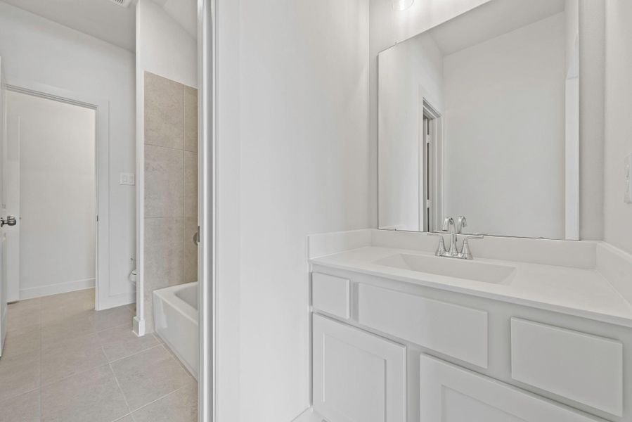 Furnished interior view inside a new home in Bridgeland, Cypress (Image 11).