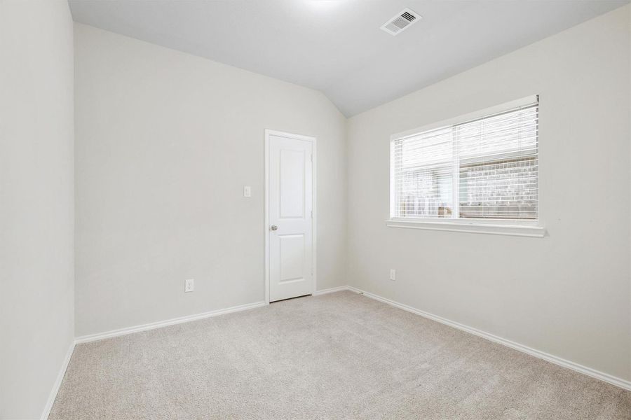 Bright, carpet, a closet, and a window that lets the light in. Whether it becomes a guest room, a home office, or a nursery, this room is ready to be whatever you need it to be. Bright, carpet, a closet, and a window that lets the light in. Whether it becomes a guest room, a home office, or a nursery, this room is ready to be whatever you need it to be.