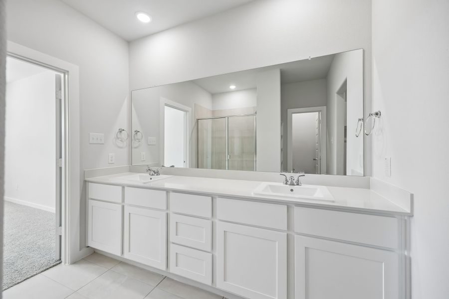Primary Bathroom in the Mesquite home plan by Trophy Signature Homes – REPRESENTATIVE PHOTO