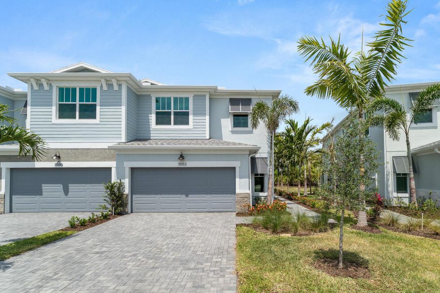 Front exterior of a new home in Avila, Jensen Beach, FL, highlighting curb appeal (Image 1).