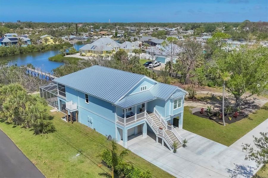 Front exterior of a new home in , Englewood, FL, highlighting curb appeal (Image 1).