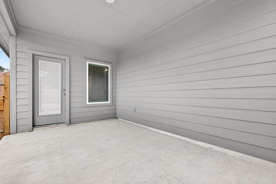 Exterior details and patio area of a home in Grand Pines, Magnolia (Image 4).
