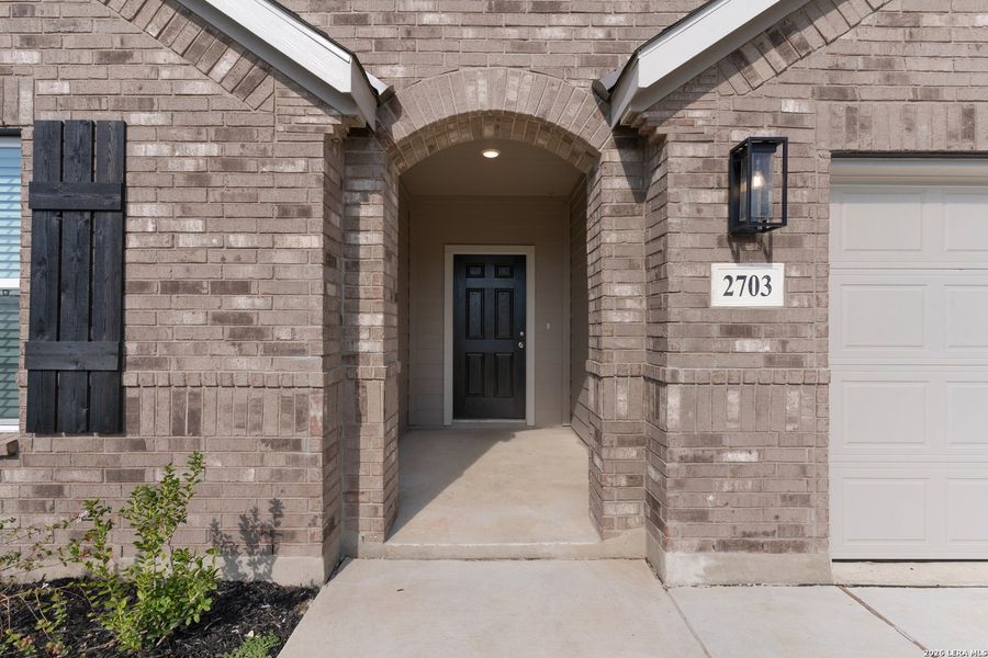 Exterior details and patio area of a home in Prairie Green, Converse (Image 14).