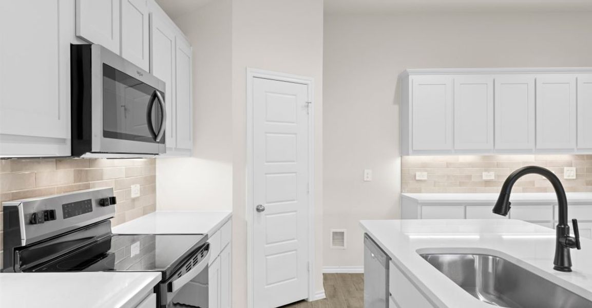 Representative exterior photo of a completed home built from the Austin by Impression Homes in Keeneland, Aubrey, TX (Image 5).