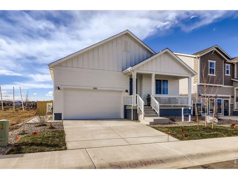 Front exterior of a new home in Trevenna, Windsor, CO, highlighting curb appeal (Image 20).