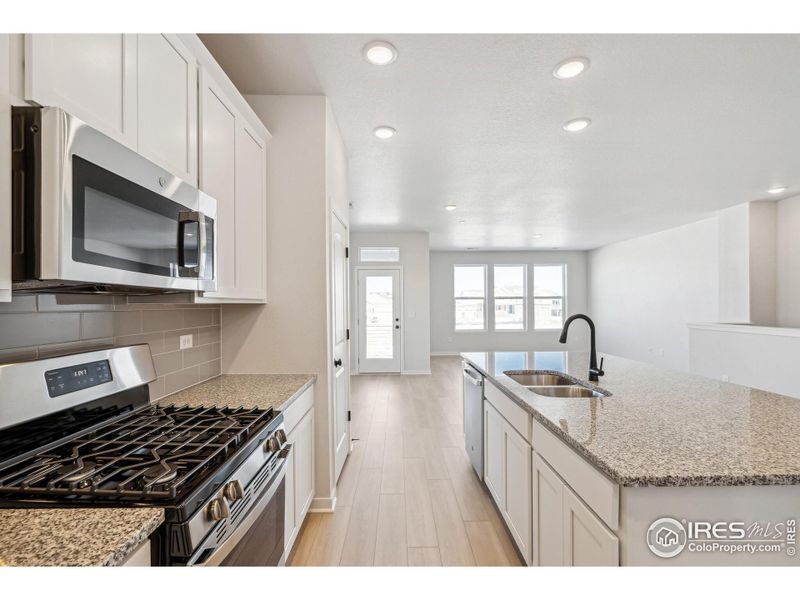 Furnished interior view inside a new home in Kinston Mainstreet Townhomes, Loveland (Image 6).