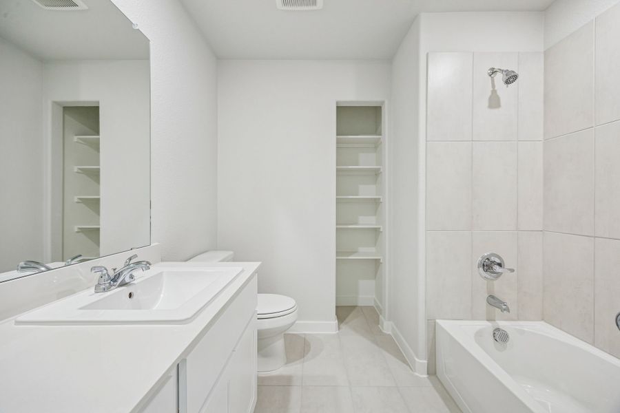 Bathroom in the Stanley II home plan by Trophy Signature Homes – REPRESENTATIVE PHOTO