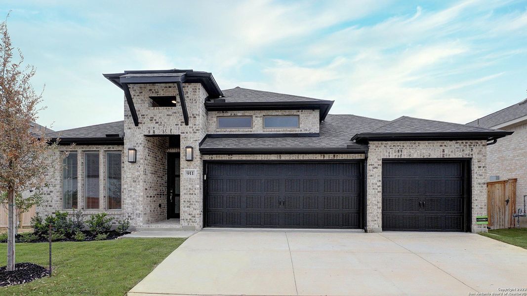 Front exterior of a new home in Weston Oaks 55', San Antonio, TX, highlighting curb appeal (Image 19). Front exterior of a new home in Weston Oaks 55', San Antonio, TX, highlighting curb appeal (Image 19).