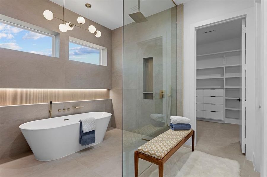 Bathroom with tile patterned floors and plus walk in shower